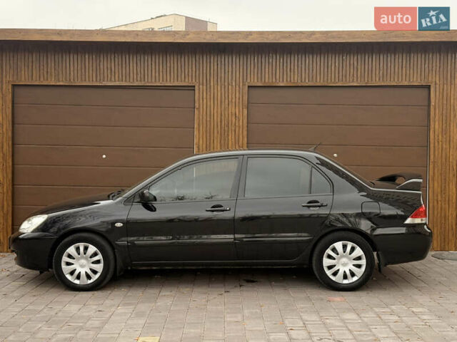 Чорний Міцубісі Lancer, об'ємом двигуна 1.6 л та пробігом 265 тис. км за 4700 $, фото 13 на Automoto.ua
