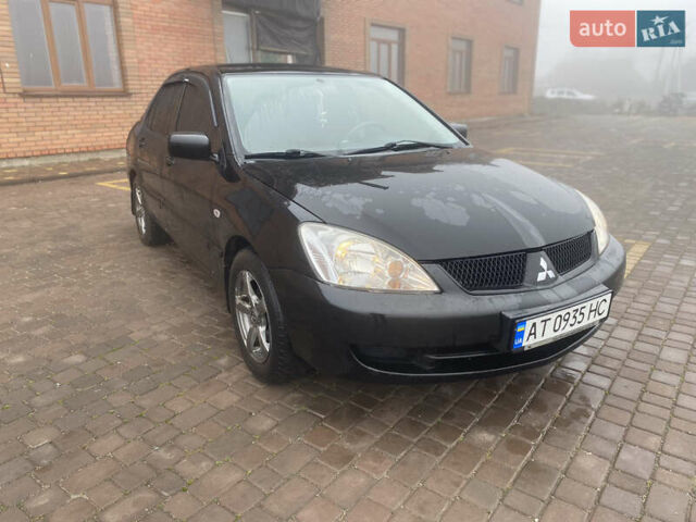 Черный Мицубиси Лансер, объемом двигателя 1.58 л и пробегом 211 тыс. км за 6333 $, фото 15 на Automoto.ua