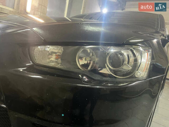 Черный Мицубиси Лансер, объемом двигателя 2 л и пробегом 200 тыс. км за 8000 $, фото 13 на Automoto.ua