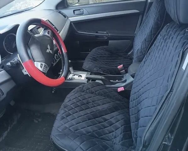 Черный Мицубиси Лансер, объемом двигателя 2 л и пробегом 210 тыс. км за 6500 $, фото 7 на Automoto.ua