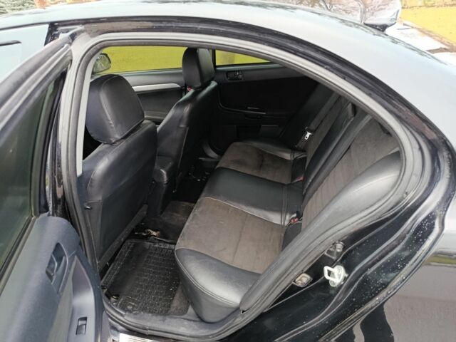 Черный Мицубиси Лансер, объемом двигателя 2 л и пробегом 200 тыс. км за 5100 $, фото 3 на Automoto.ua