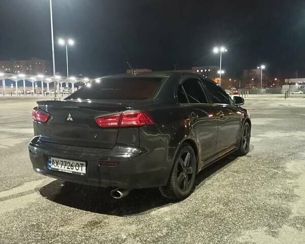 Черный Мицубиси Лансер, объемом двигателя 2 л и пробегом 240 тыс. км за 6400 $, фото 3 на Automoto.ua