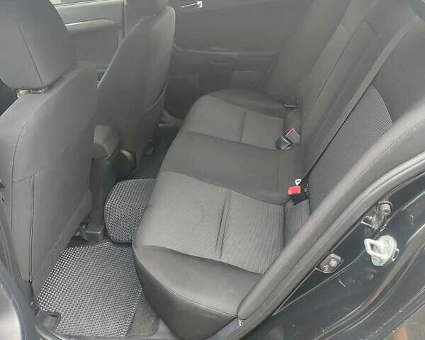 Черный Мицубиси Лансер, объемом двигателя 2 л и пробегом 229 тыс. км за 7300 $, фото 12 на Automoto.ua