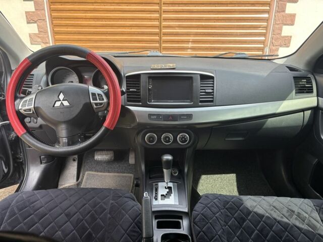 Черный Мицубиси Лансер, объемом двигателя 2 л и пробегом 210 тыс. км за 6250 $, фото 15 на Automoto.ua