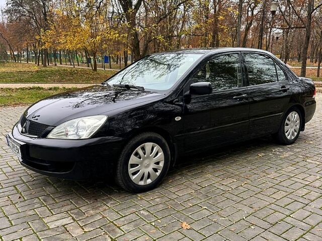 Черный Мицубиси Лансер, объемом двигателя 1.6 л и пробегом 185 тыс. км за 5500 $, фото 1 на Automoto.ua