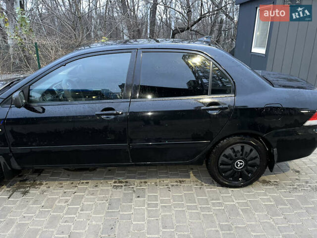 Чорний Міцубісі Lancer, об'ємом двигуна 1.6 л та пробігом 277 тис. км за 3900 $, фото 15 на Automoto.ua