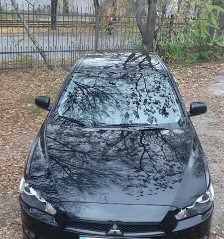 Черный Мицубиси Лансер, объемом двигателя 2 л и пробегом 63 тыс. км за 8000 $, фото 1 на Automoto.ua