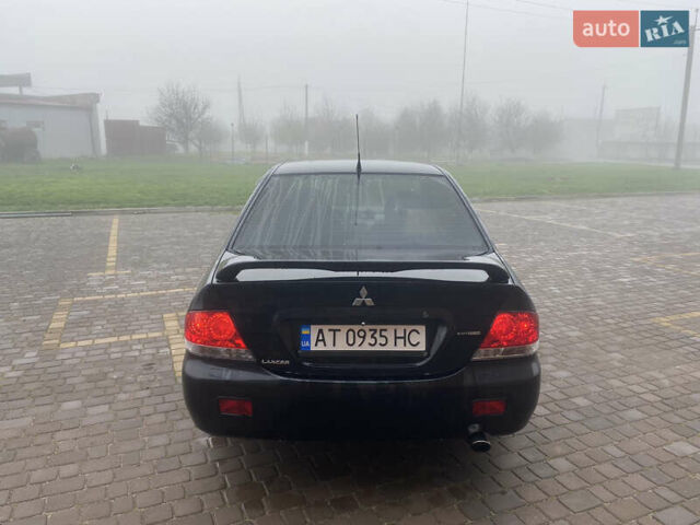 Черный Мицубиси Лансер, объемом двигателя 1.58 л и пробегом 211 тыс. км за 6333 $, фото 8 на Automoto.ua