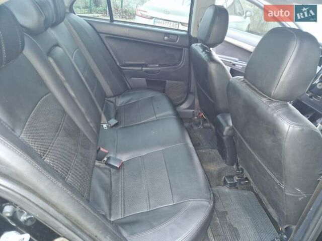 Чорний Міцубісі Lancer, об'ємом двигуна 2 л та пробігом 300 тис. км за 6000 $, фото 5 на Automoto.ua