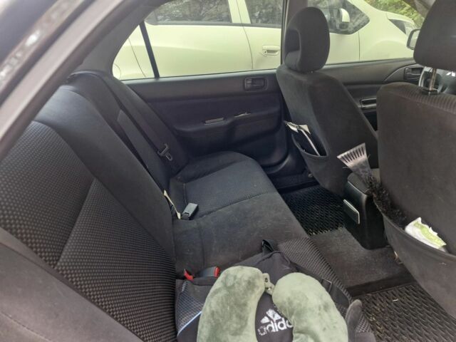 Черный Мицубиси Лансер, объемом двигателя 1.6 л и пробегом 243 тыс. км за 2900 $, фото 4 на Automoto.ua