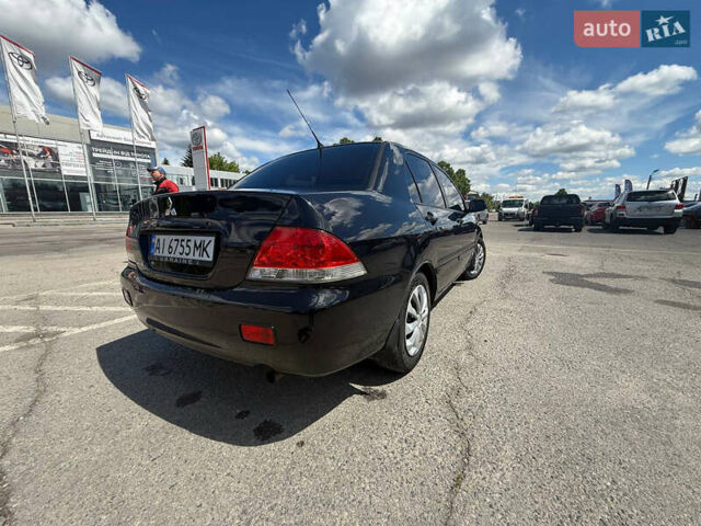 Чорний Міцубісі Lancer, об'ємом двигуна 1.6 л та пробігом 292 тис. км за 3600 $, фото 6 на Automoto.ua