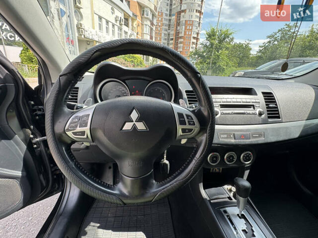 Черный Мицубиси Лансер, объемом двигателя 2 л и пробегом 234 тыс. км за 7400 $, фото 9 на Automoto.ua