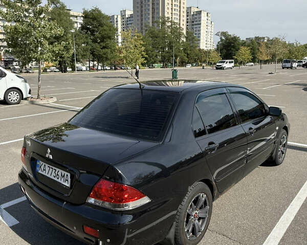 Черный Мицубиси Лансер, объемом двигателя 1.6 л и пробегом 321 тыс. км за 5000 $, фото 6 на Automoto.ua