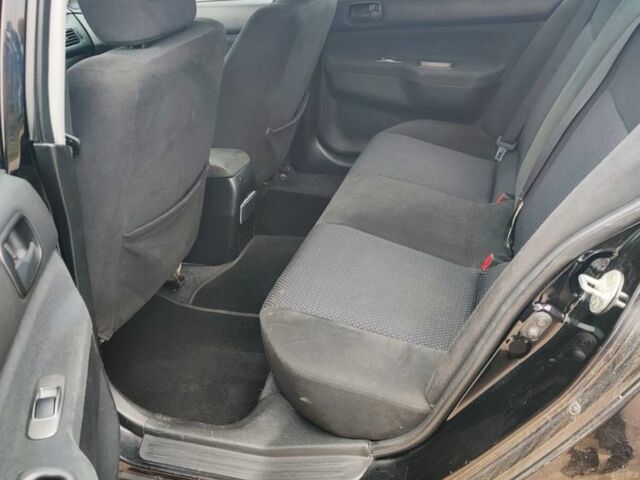 Чорний Міцубісі Lancer, об'ємом двигуна 1.6 л та пробігом 257 тис. км за 4200 $, фото 3 на Automoto.ua