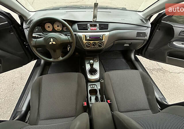 Чорний Міцубісі Lancer, об'ємом двигуна 1.58 л та пробігом 167 тис. км за 4800 $, фото 14 на Automoto.ua