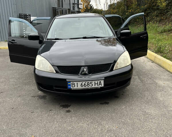 Чорний Міцубісі Lancer, об'ємом двигуна 1.58 л та пробігом 192 тис. км за 4500 $, фото 6 на Automoto.ua