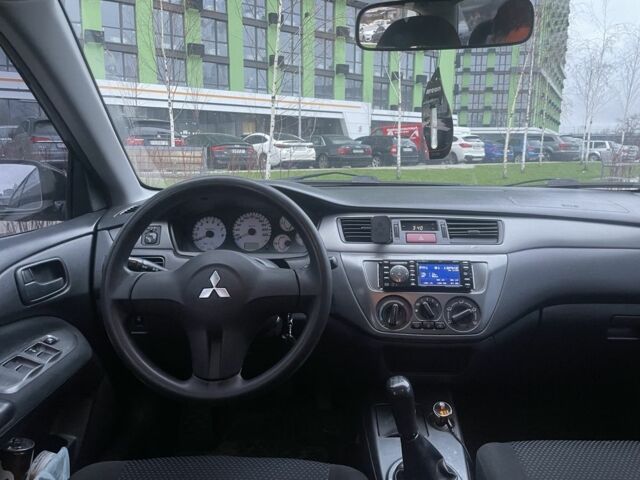 Черный Мицубиси Лансер, объемом двигателя 1.6 л и пробегом 226 тыс. км за 3750 $, фото 7 на Automoto.ua