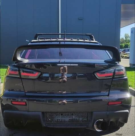 Чорний Міцубісі Lancer, об'ємом двигуна 2 л та пробігом 134 тис. км за 29034 $, фото 3 на Automoto.ua