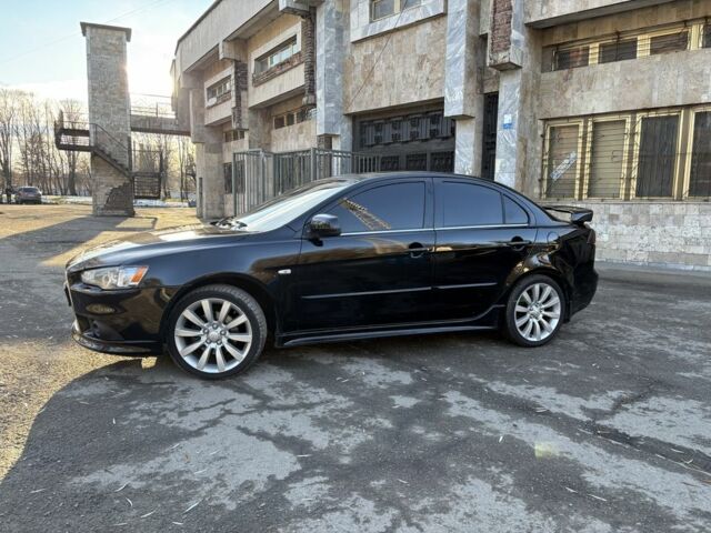 Черный Мицубиси Лансер, объемом двигателя 2 л и пробегом 236 тыс. км за 6550 $, фото 1 на Automoto.ua