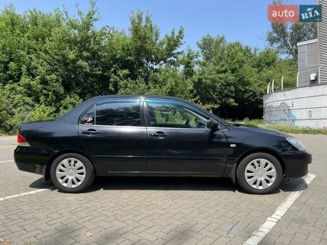 Чорний Міцубісі Lancer, об'ємом двигуна 1.6 л та пробігом 296 тис. км за 4200 $, фото 3 на Automoto.ua