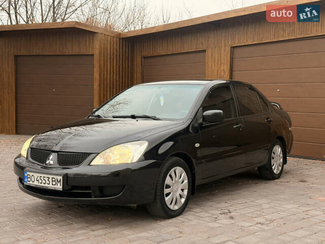 Чорний Міцубісі Lancer, об'ємом двигуна 1.6 л та пробігом 265 тис. км за 4700 $, фото 5 на Automoto.ua