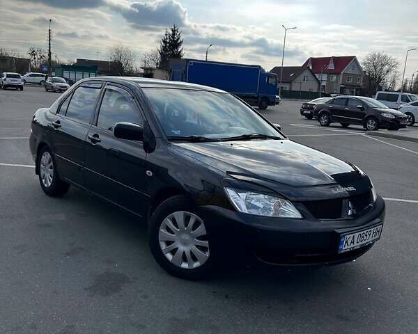Чорний Міцубісі Lancer, об'ємом двигуна 1.6 л та пробігом 310 тис. км за 3500 $, фото 31 на Automoto.ua