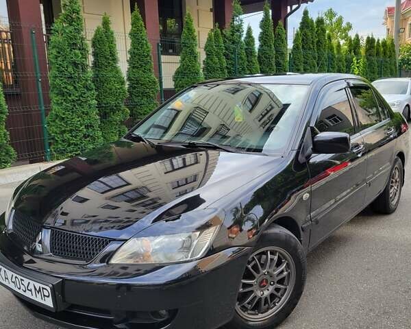 Чорний Міцубісі Lancer, об'ємом двигуна 1.58 л та пробігом 334 тис. км за 4750 $, фото 5 на Automoto.ua