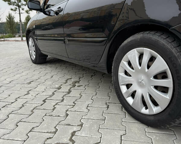 Черный Мицубиси Лансер, объемом двигателя 1.6 л и пробегом 240 тыс. км за 5200 $, фото 5 на Automoto.ua