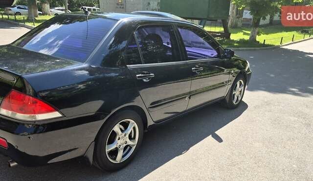 Чорний Міцубісі Lancer, об'ємом двигуна 1.6 л та пробігом 210 тис. км за 4800 $, фото 1 на Automoto.ua