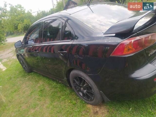 Чорний Міцубісі Lancer, об'ємом двигуна 2 л та пробігом 183 тис. км за 5000 $, фото 3 на Automoto.ua