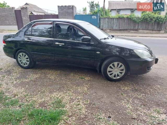 Чорний Міцубісі Lancer, об'ємом двигуна 1.6 л та пробігом 215 тис. км за 4900 $, фото 1 на Automoto.ua