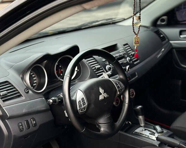 Черный Мицубиси Лансер, объемом двигателя 2 л и пробегом 236 тыс. км за 7950 $, фото 6 на Automoto.ua