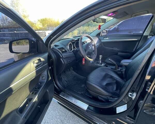 Чорний Міцубісі Lancer, об'ємом двигуна 2 л та пробігом 223 тис. км за 7800 $, фото 11 на Automoto.ua