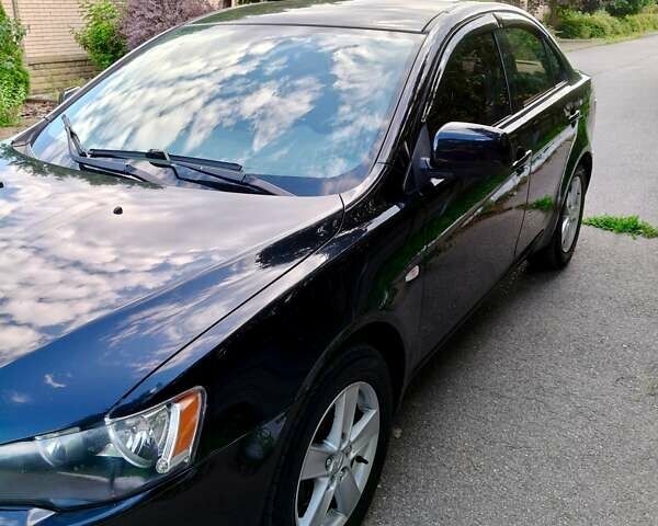 Черный Мицубиси Лансер, объемом двигателя 1.8 л и пробегом 172 тыс. км за 7100 $, фото 2 на Automoto.ua