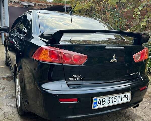 Черный Мицубиси Лансер, объемом двигателя 2 л и пробегом 214 тыс. км за 6300 $, фото 6 на Automoto.ua