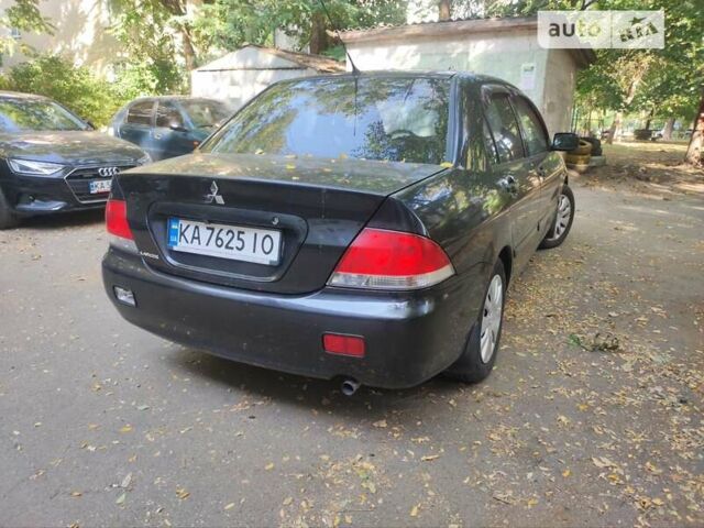 Чорний Міцубісі Lancer, об'ємом двигуна 1.6 л та пробігом 335 тис. км за 3100 $, фото 12 на Automoto.ua