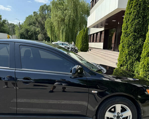 Чорний Міцубісі Lancer, об'ємом двигуна 2 л та пробігом 217 тис. км за 7800 $, фото 45 на Automoto.ua