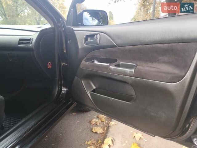 Чорний Міцубісі Lancer, об'ємом двигуна 1.58 л та пробігом 323 тис. км за 4500 $, фото 6 на Automoto.ua