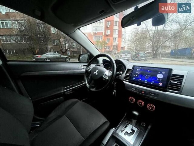 Черный Мицубиси Лансер, объемом двигателя 2 л и пробегом 217 тыс. км за 7000 $, фото 41 на Automoto.ua