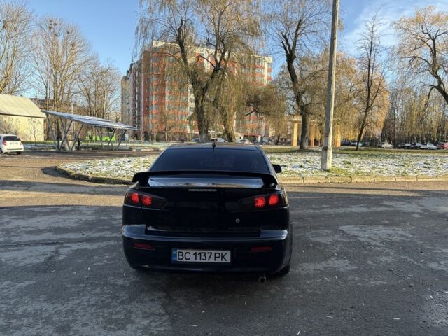 Черный Мицубиси Лансер, объемом двигателя 2 л и пробегом 236 тыс. км за 6550 $, фото 5 на Automoto.ua