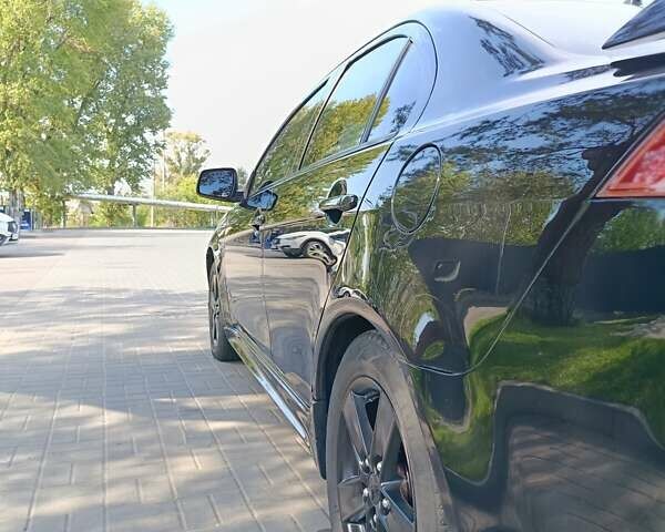 Мицубиси Лансер 2008 в Днепре (Днепропетровске) на Automoto.ua Черный Мицубиси Лансер, объемом двигателя 2 л и пробегом 196 тыс. км за 6900 $, фото 23 на Automoto.ua