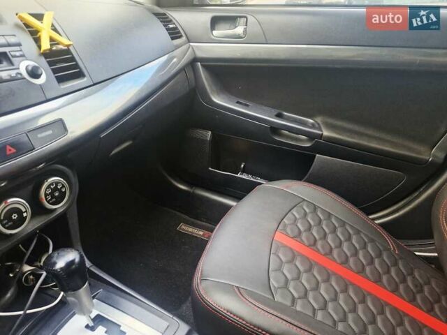 Чорний Міцубісі Lancer, об'ємом двигуна 2 л та пробігом 240 тис. км за 7850 $, фото 29 на Automoto.ua