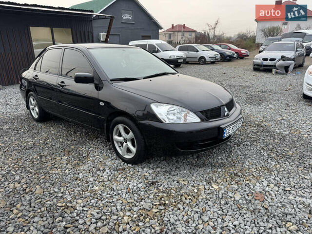 Черный Мицубиси Лансер, объемом двигателя 1.58 л и пробегом 202 тыс. км за 4100 $, фото 2 на Automoto.ua