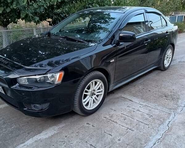 Черный Мицубиси Лансер, объемом двигателя 1.5 л и пробегом 167 тыс. км за 5500 $, фото 1 на Automoto.ua