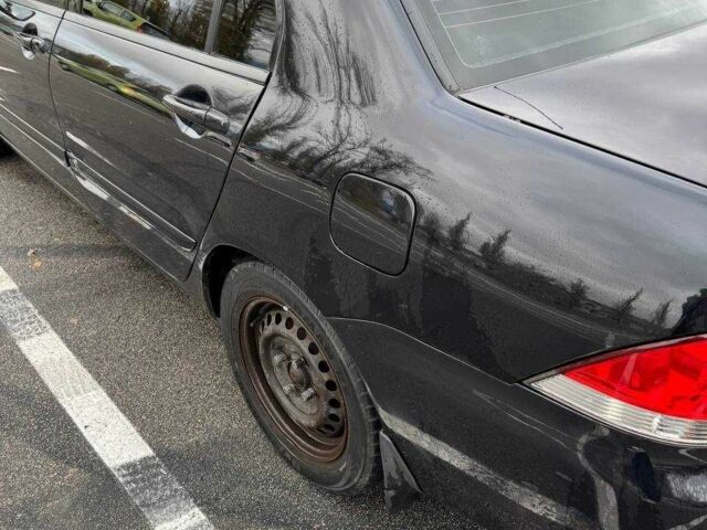 Чорний Міцубісі Lancer, об'ємом двигуна 1.6 л та пробігом 245 тис. км за 4500 $, фото 11 на Automoto.ua