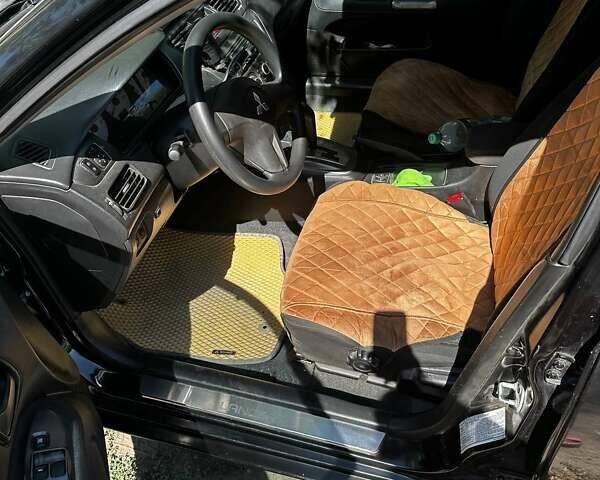 Чорний Міцубісі Lancer, об'ємом двигуна 1.6 л та пробігом 294 тис. км за 6500 $, фото 4 на Automoto.ua