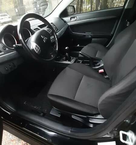 Черный Мицубиси Лансер, объемом двигателя 2 л и пробегом 63 тыс. км за 8000 $, фото 7 на Automoto.ua