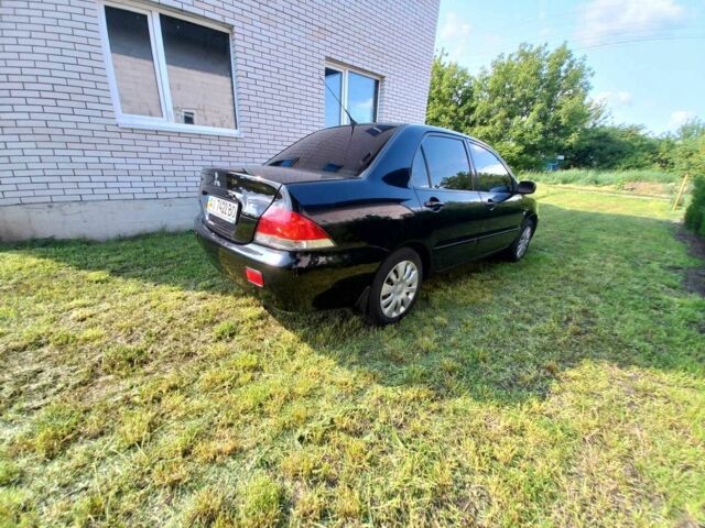 Чорний Міцубісі Lancer, об'ємом двигуна 1.6 л та пробігом 230 тис. км за 4700 $, фото 3 на Automoto.ua