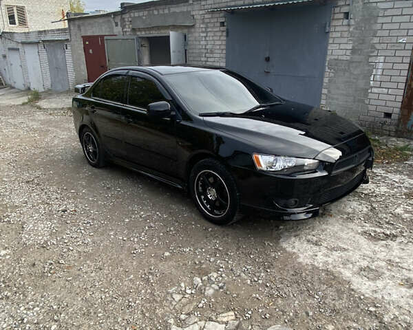 Черный Мицубиси Лансер, объемом двигателя 2 л и пробегом 275 тыс. км за 7700 $, фото 1 на Automoto.ua