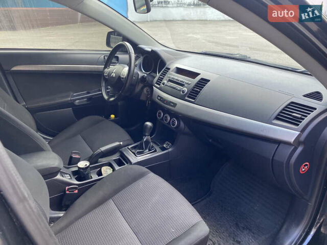 Черный Мицубиси Лансер, объемом двигателя 2 л и пробегом 200 тыс. км за 5500 $, фото 5 на Automoto.ua